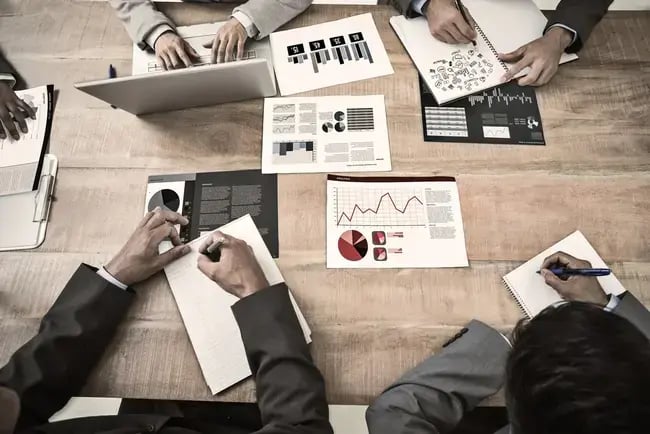 Brainstorm_against_business_interface_with_graphs_and_data_650x434